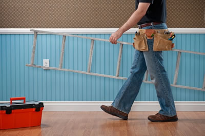 man walking holding a stair